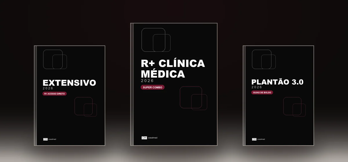 Três apostilas impressas em pé sobre uma superfície iluminada